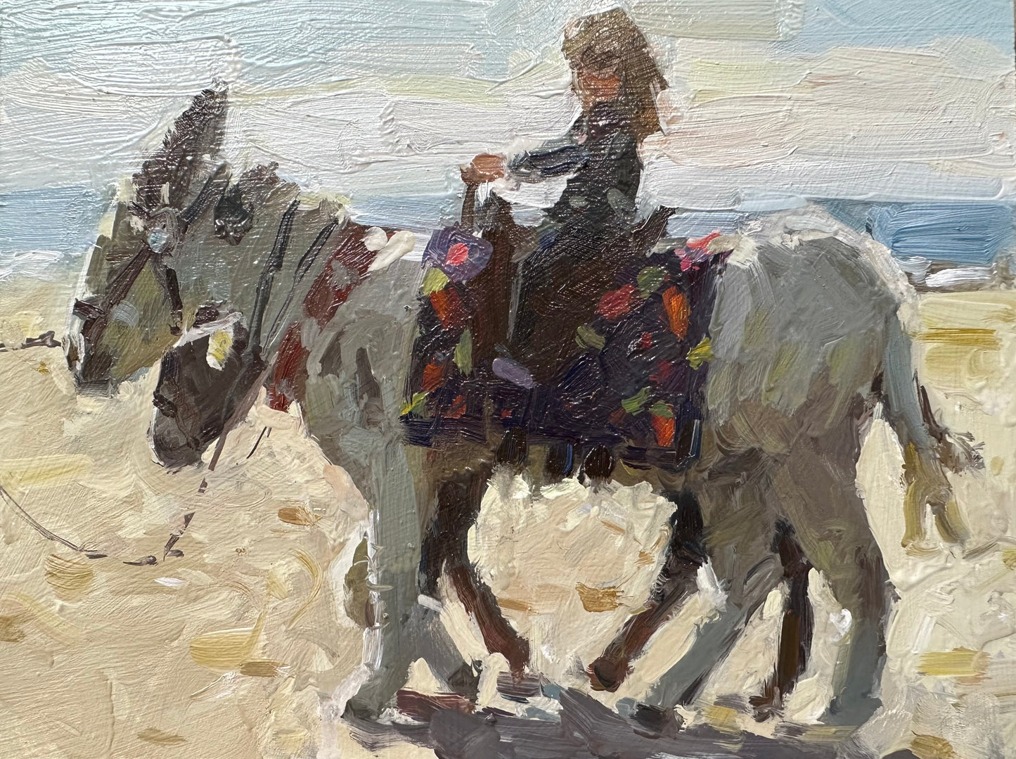 Girl-riding-a-donkey-painting-on-Blackpool-beach