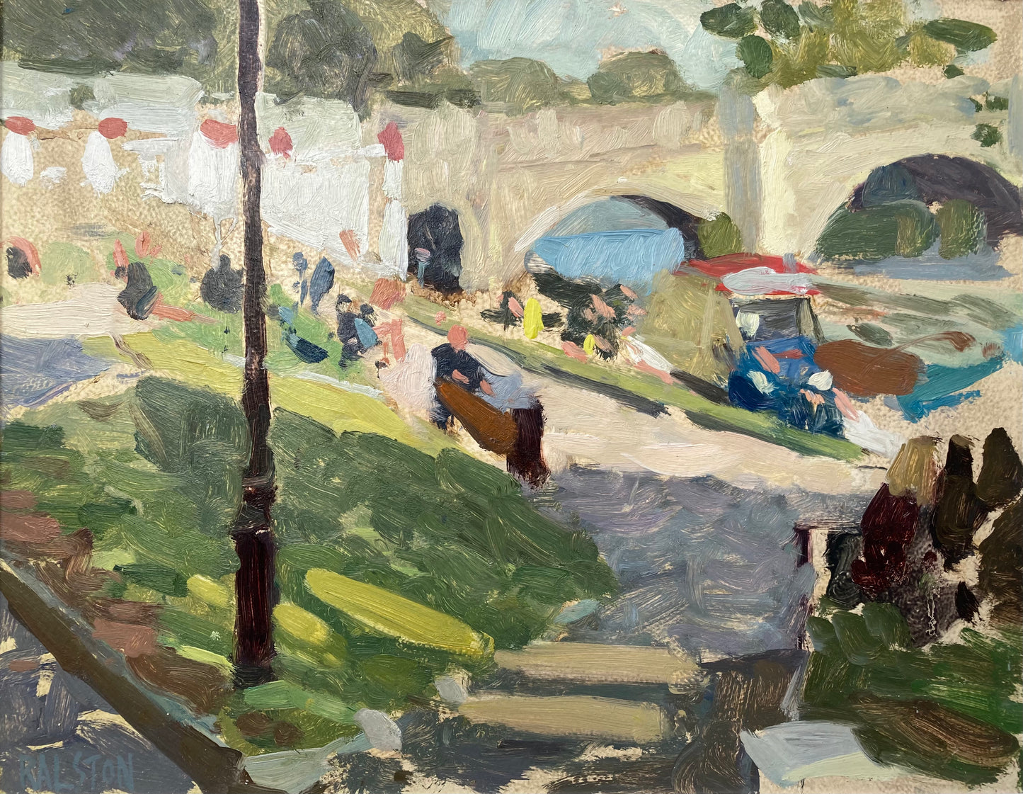 Dappled sunlight on the grass and path with Richmond Bridge in the distance and an ice cream van
