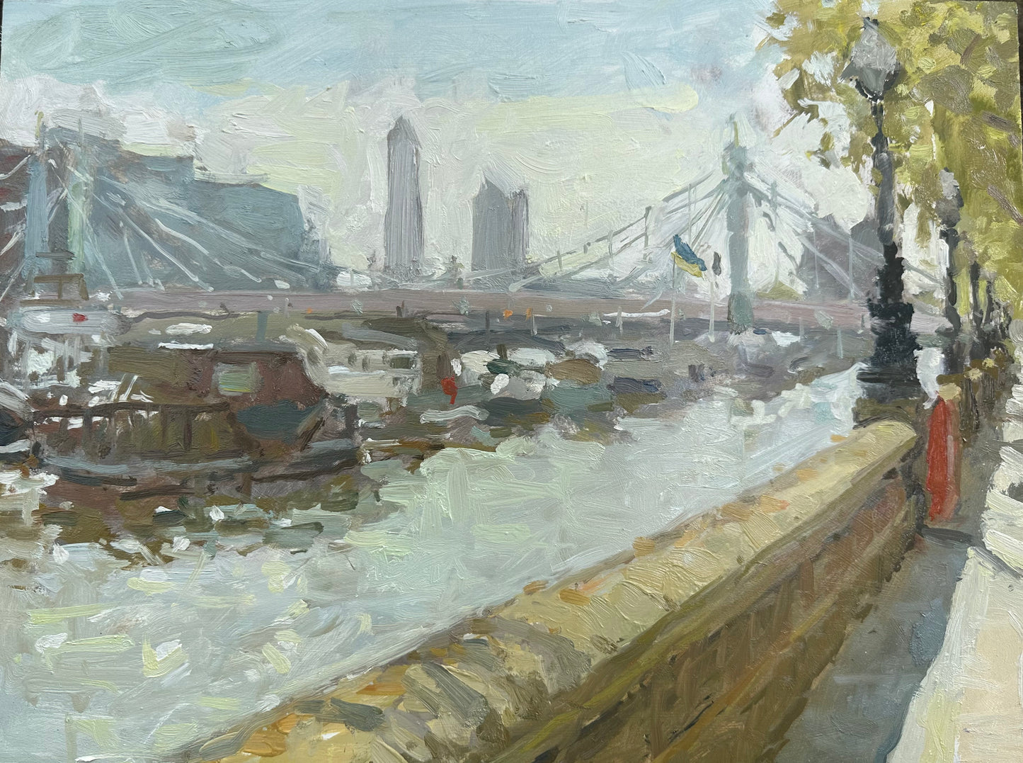A Summers day on Chelsea embankment looking towards Albert Bridge and a view of the Thames
