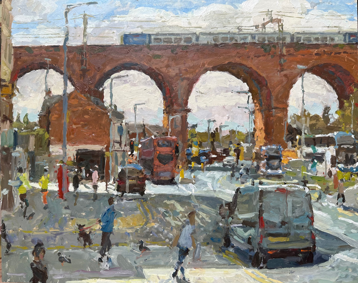 Stockport viaduct from Heaton Lane with a train passing over and parked car, with pedestrians, one with a dog