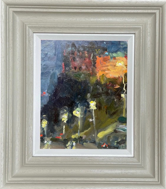 A framed impressionist landscape painting featuring dark silhouetted trees and foliage with a glowing orange sky, set in a wide, distressed light gray frame with a white mat.