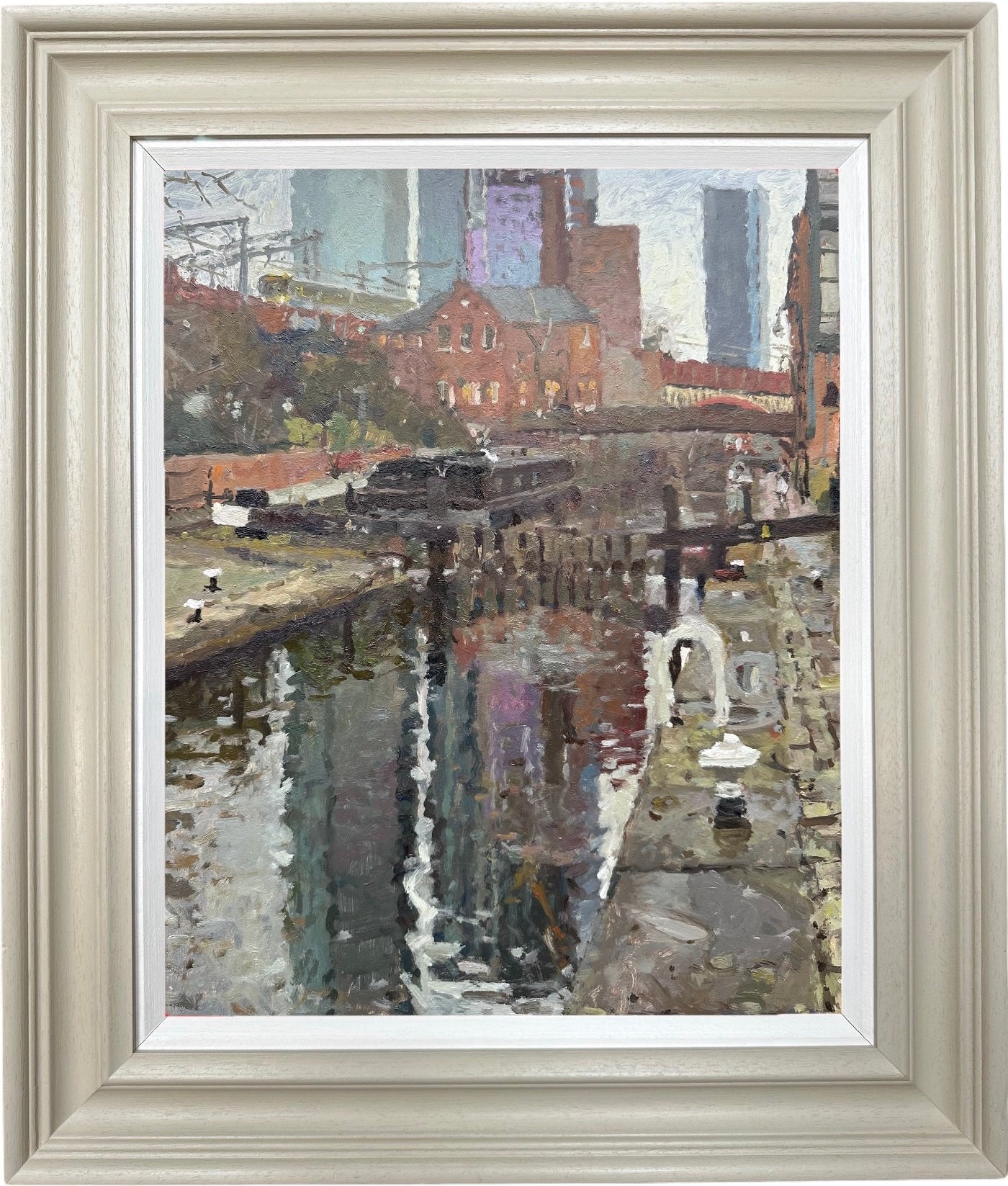 An original pleinair oil painting of Manchester buildings reflecting in the water of Rochdale canal