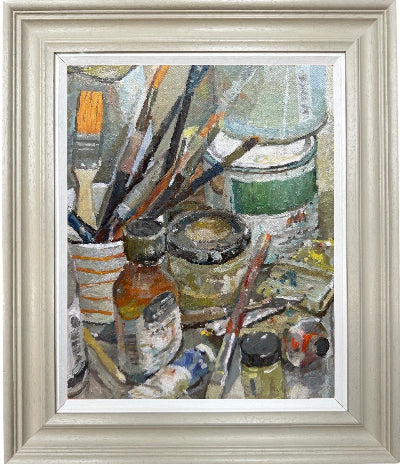 painting from life in the studio on a table top of paint and brushes