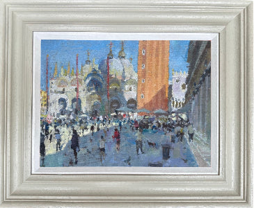 An impressionist-style painting of a bustling Venetian st.Marco square with the Basilica cathedral and Campanile tower, presented in a white frame with a white mat.