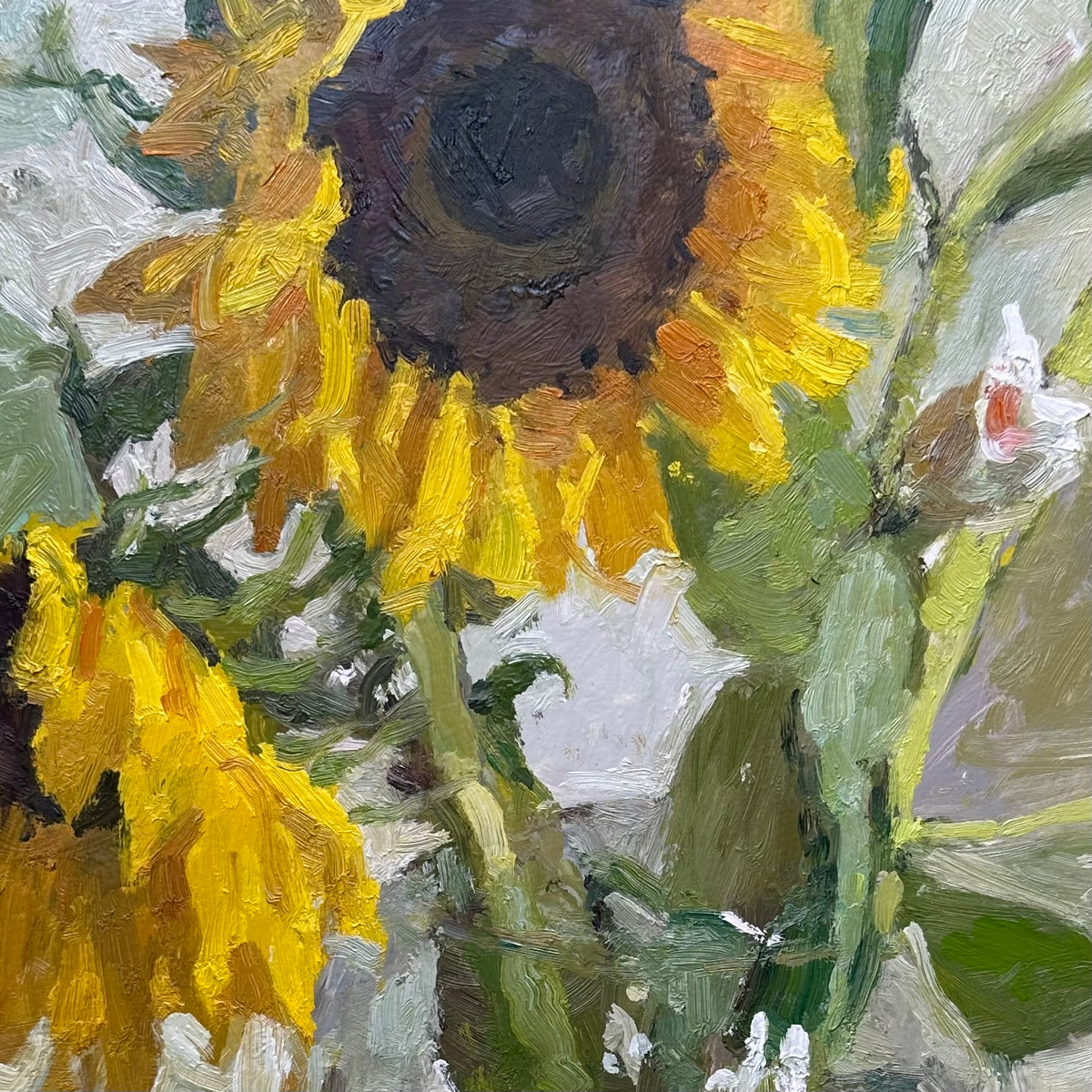 Impressionistic oil painting of sunflowers with thick brushstrokes, featuring a large yellow and brown sunflower head, another partially visible sunflower, green stems, and a soft gray-green background.