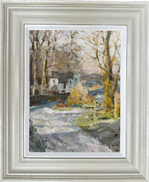 A framed impressionist landscape plainer painting by Adam Ralston ROI, featuring bare trees, a snowy path, and muted yellow-green foliage, presented in a wide, light gray frame with a white mat.